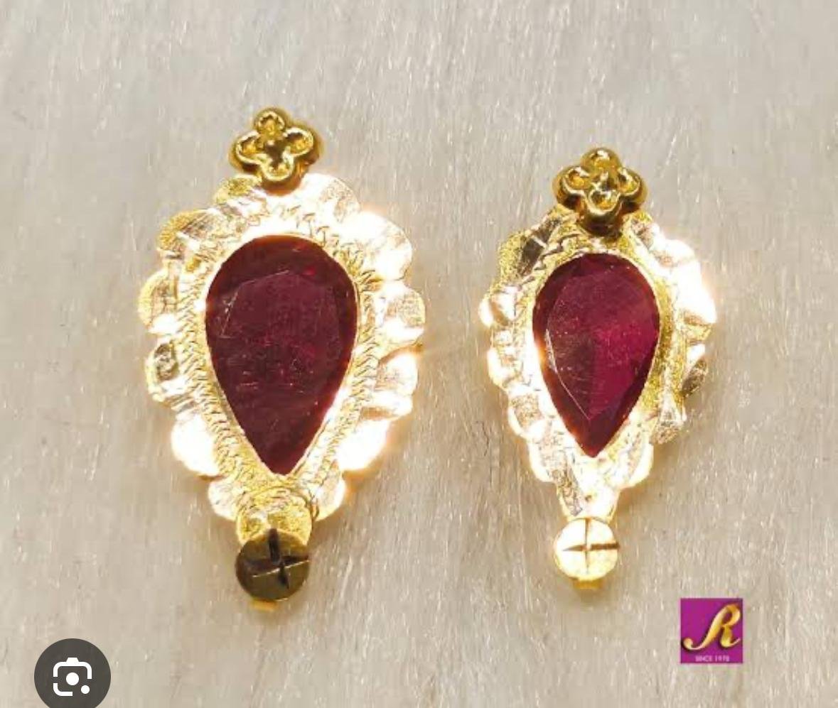 Artisan hand-finishing a gold jewelry piece